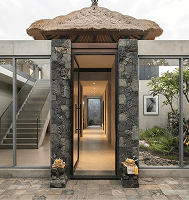 Narrow stone doorway leading to a tight corridor